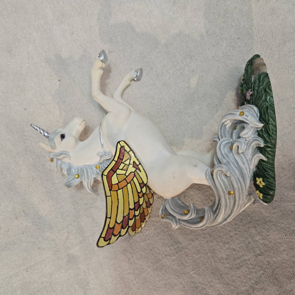 White and Gold Mythical Creature Figurine with Dynamic Pose